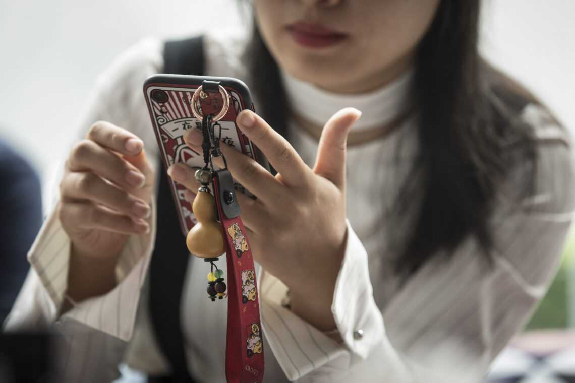 A woman holding a cellphone