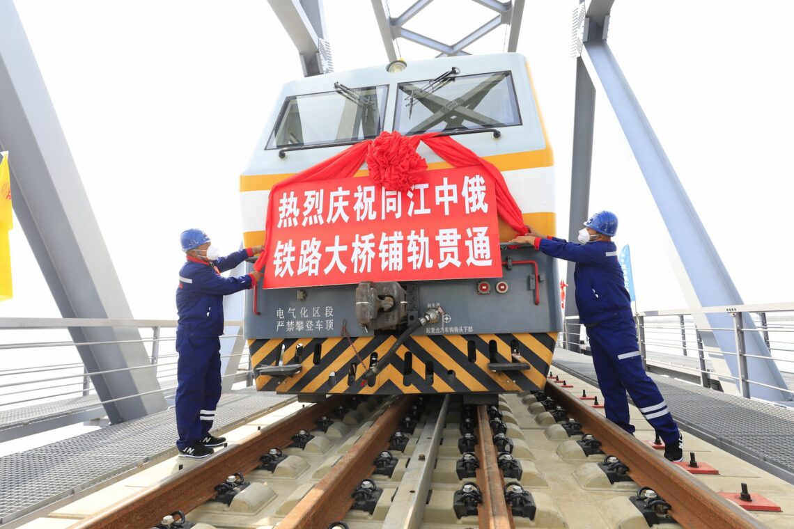 Workers celebrate at the construction site of the China-Russia Tongjiang-Nizhneleninskoye cross-border railway bridge in Jiamusi, China.