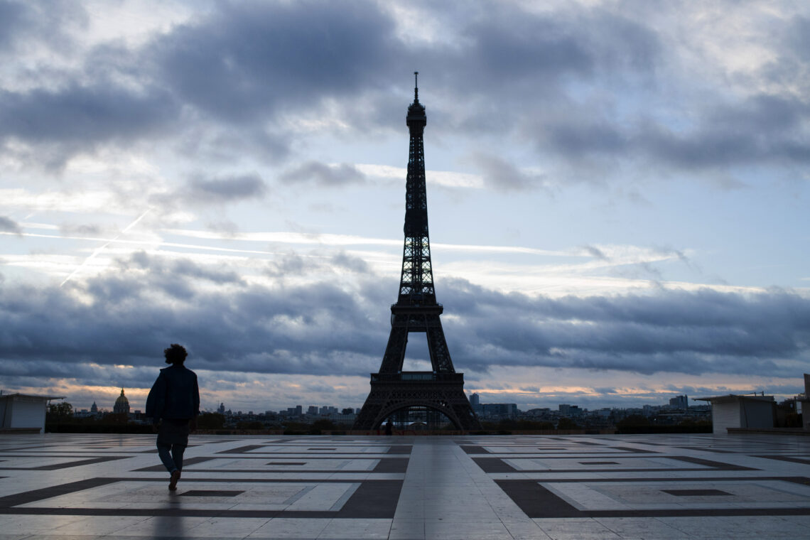 An empty square in front of the Eiffel Tower during Covid-19 lockdown government intervention Europe