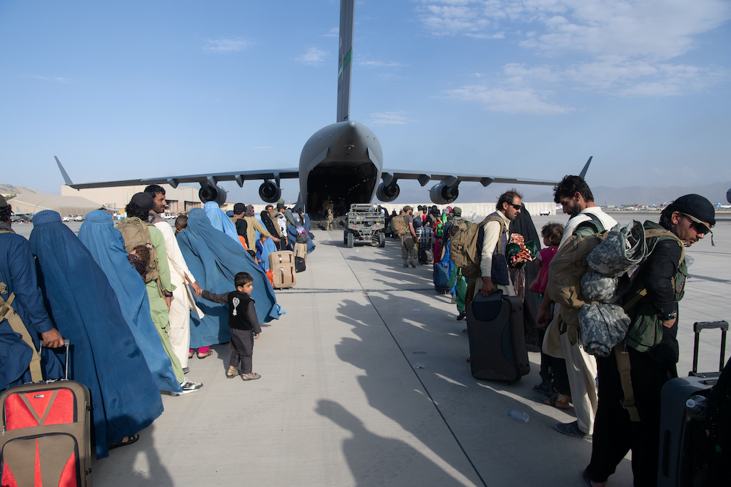 A picture of the U.S. Air Force transport plane being loaded with people who needed to be evacuated from the Taliban-taken Kabul by August 31, 2021 - refugee crisis Europe