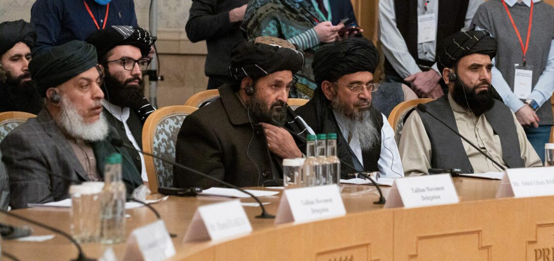 Mullah Abdul Ghani Baradar (C) and other members of the Taliban attend a conference on Afghanistan in Moscow in 2021