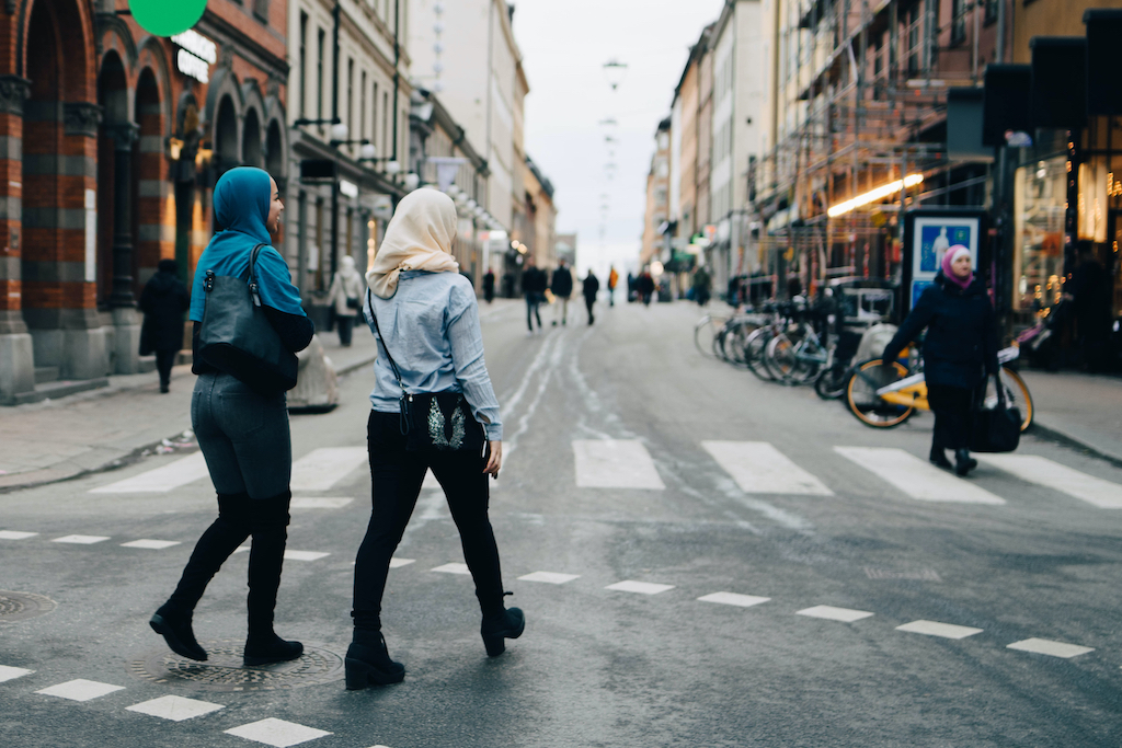 Two Muslim women walk on the street in Sweden