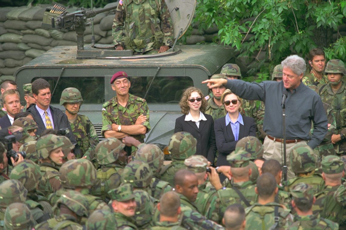 The Clinton family with U.S. troops in the Balkans domestic consensus