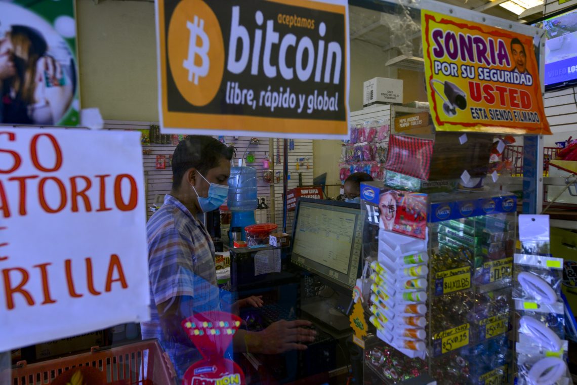 A shop in El Salvador with a sign showing that it accepts bitcoin. (war on cash)