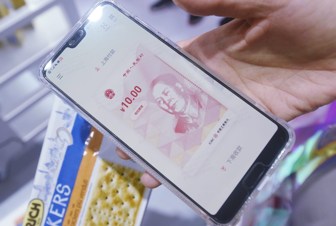 China’s digital yuan shown on a smartphone (war on cash)