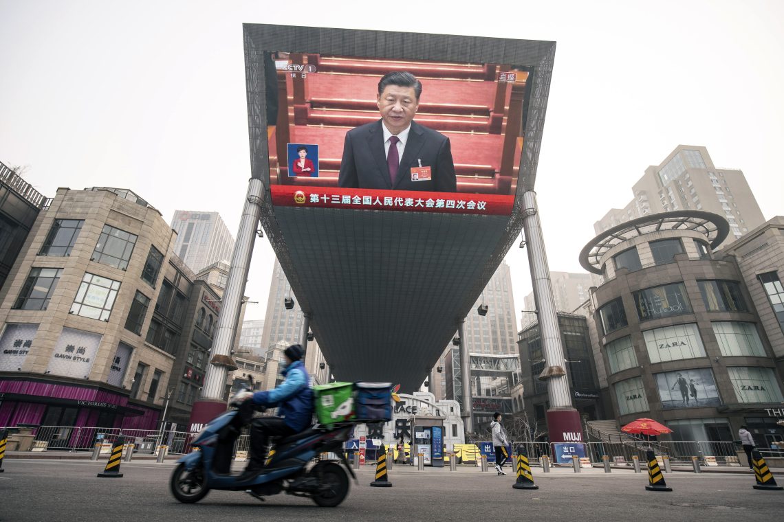 Xi Jinping on a television screen in Beijing
