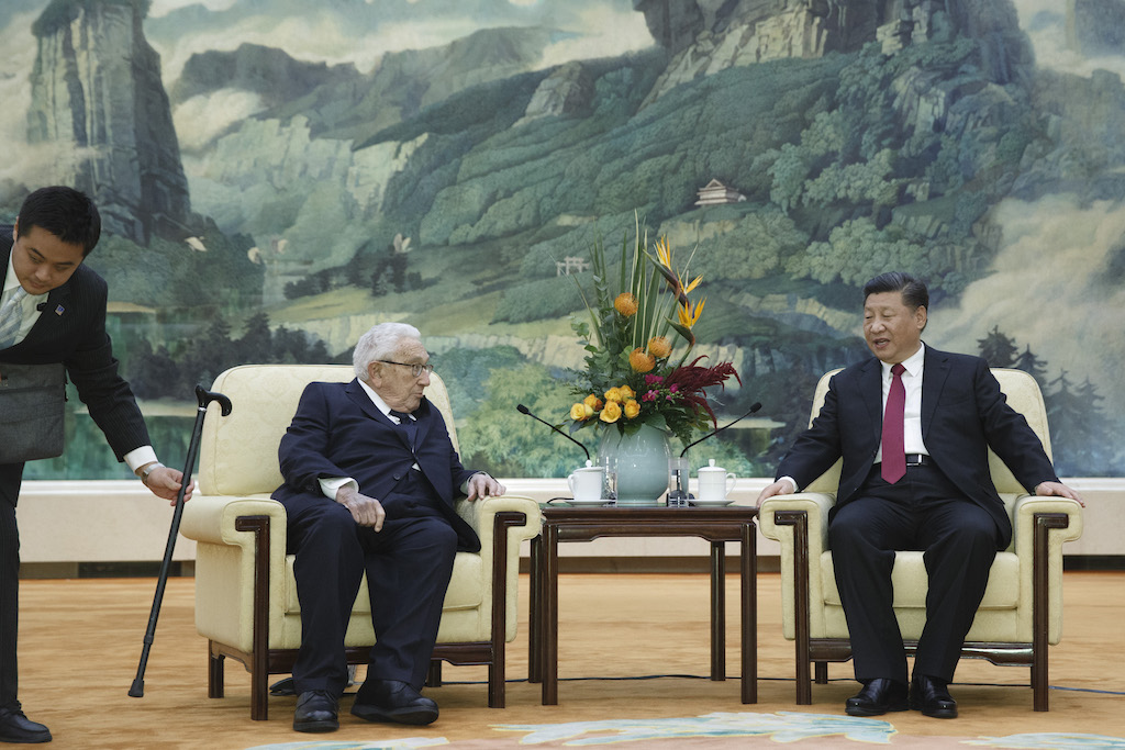 Henry Kissinger and Xi Jinping chat in Beijing’s Great Hall of People (Ukraine Taiwan security strategies)