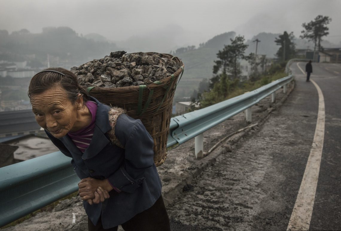 Woman with coal (China energy)