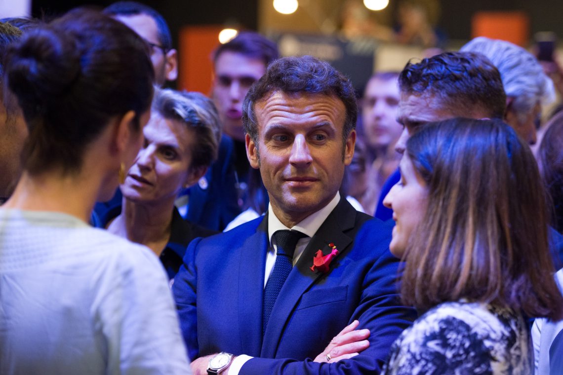 Emmanuel Macron in a crowd france mistrust