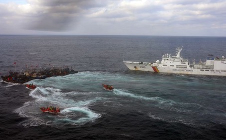 South Korea’s Coast Guard vessel rounds up Chinese trawlers in its fisheries