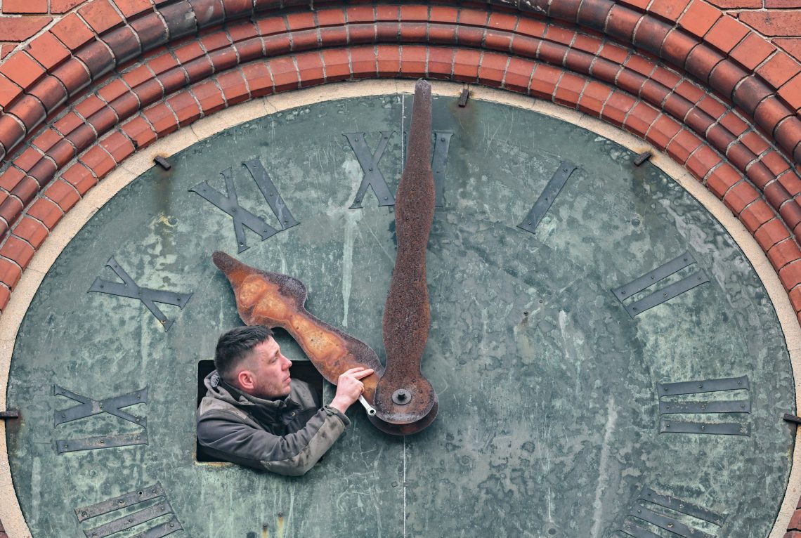Restoration works on the Friedenskirche tower clock in Brandenburg, Germany