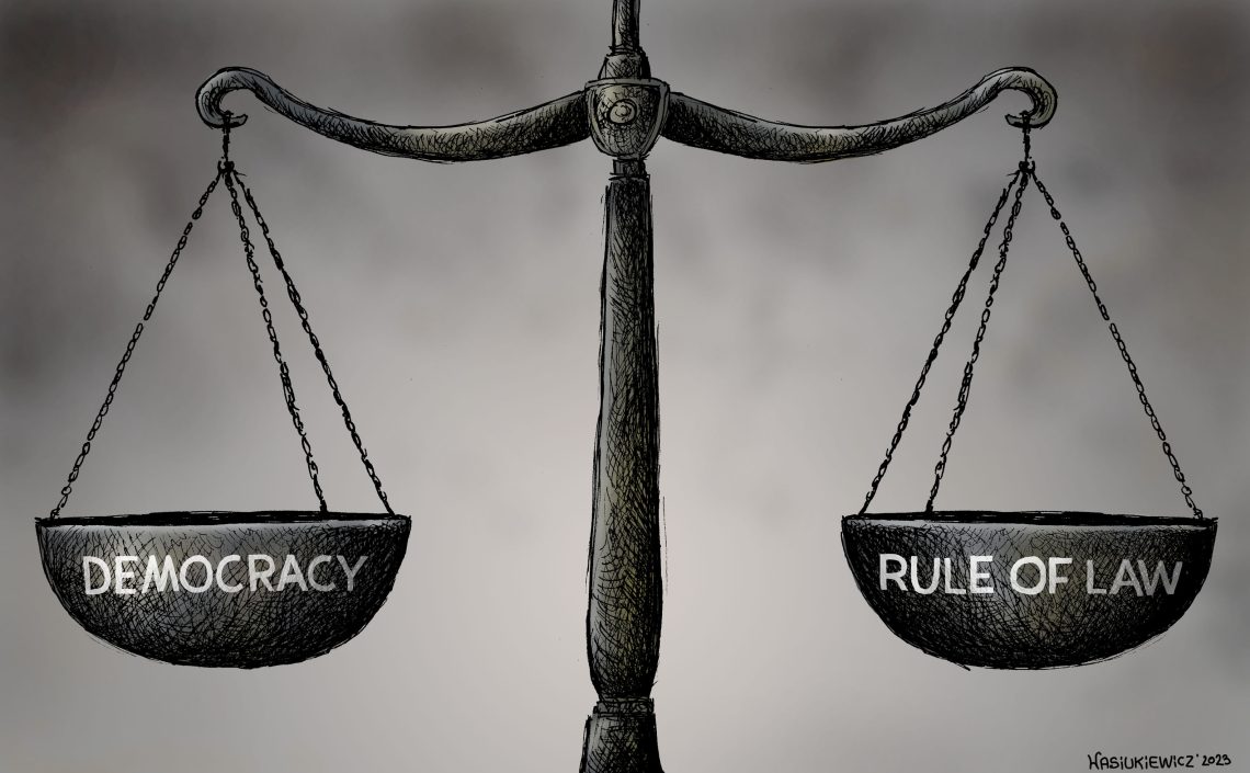 A scale showing democracy on one side, and the rule of law on the other