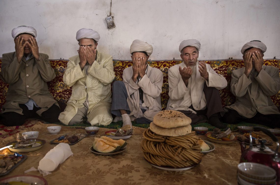 Uighur prayer in Xinjiang, China