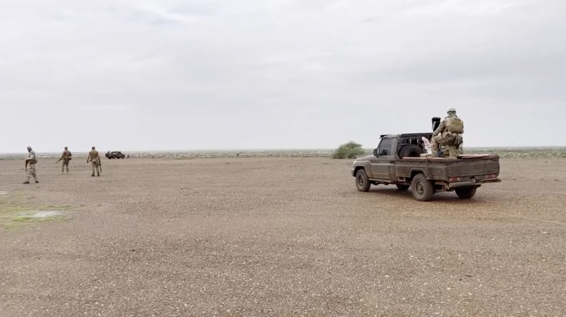 A man on a truck in a desert