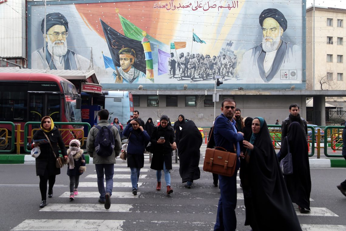 A Tehran street with a large government propaganda poster
