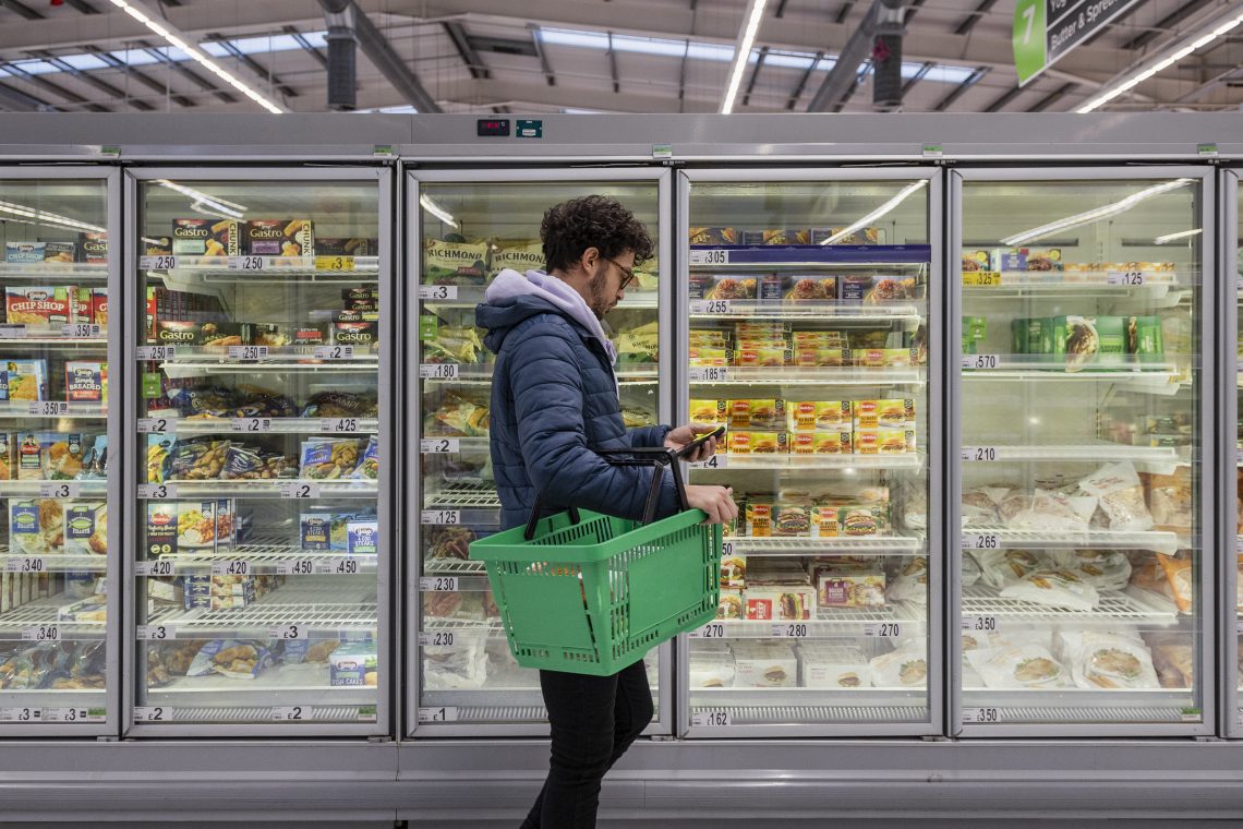 Man in grocery store (inflation)