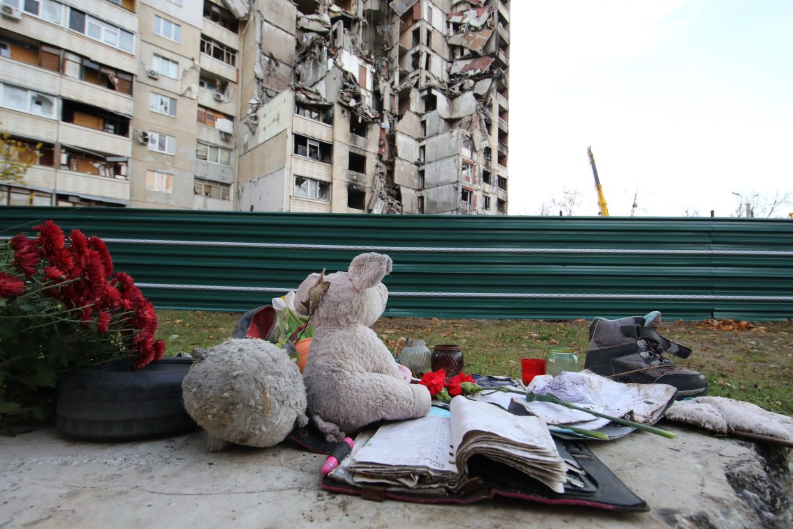 A memorial is seen outside a residential building destroyed in the shelling of Russian troops in the Northern Saltivka neighborhood.