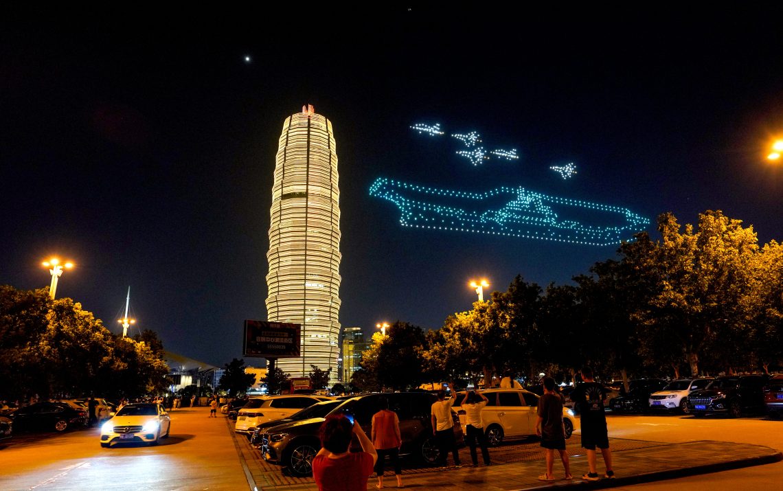 Drones in formation of an aircraft carrier and fighter jets in Zhengzhou, China, in August 2023.