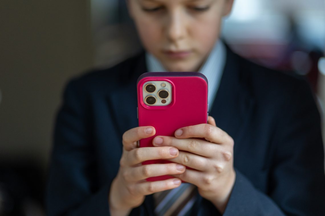 Child with cell phone (GDPR)