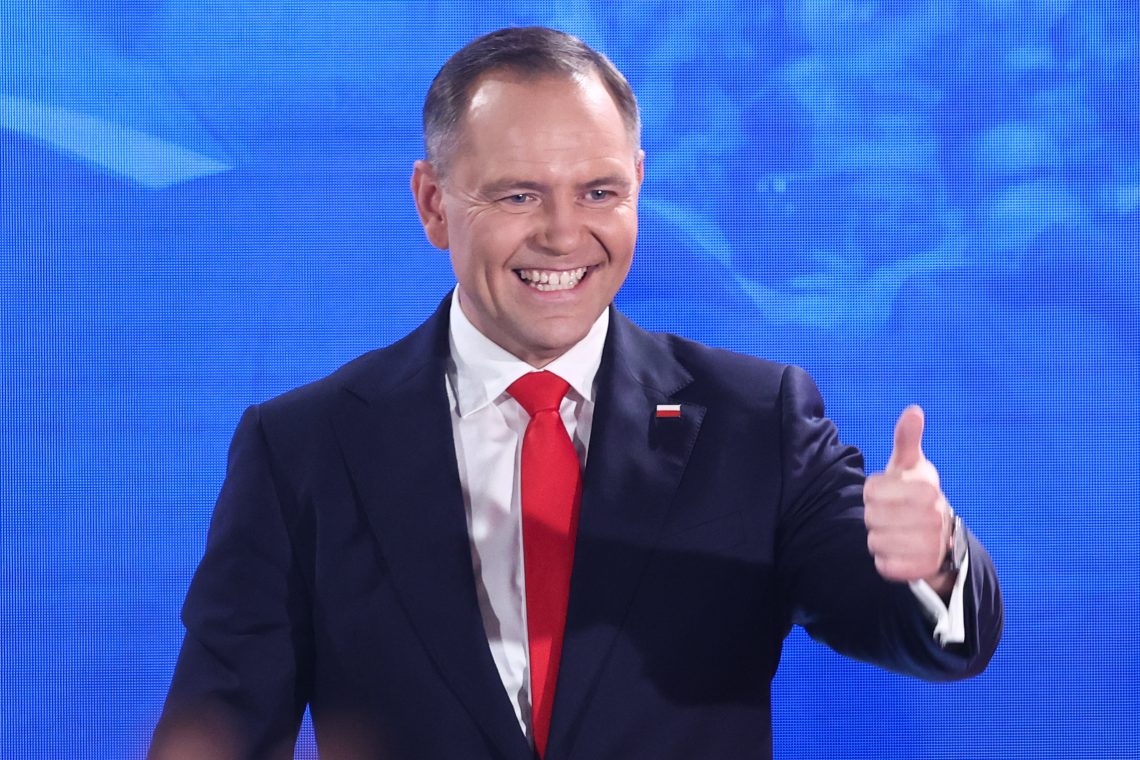 Karol Nawrocki gives a thumbs up on the eve he is elected president.