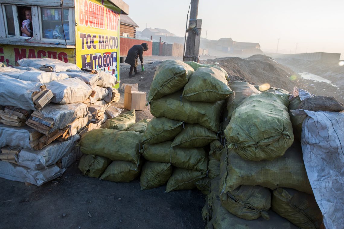 Sacks of coal for sale along a roadside in Ulaanbaatar, Mongolia.