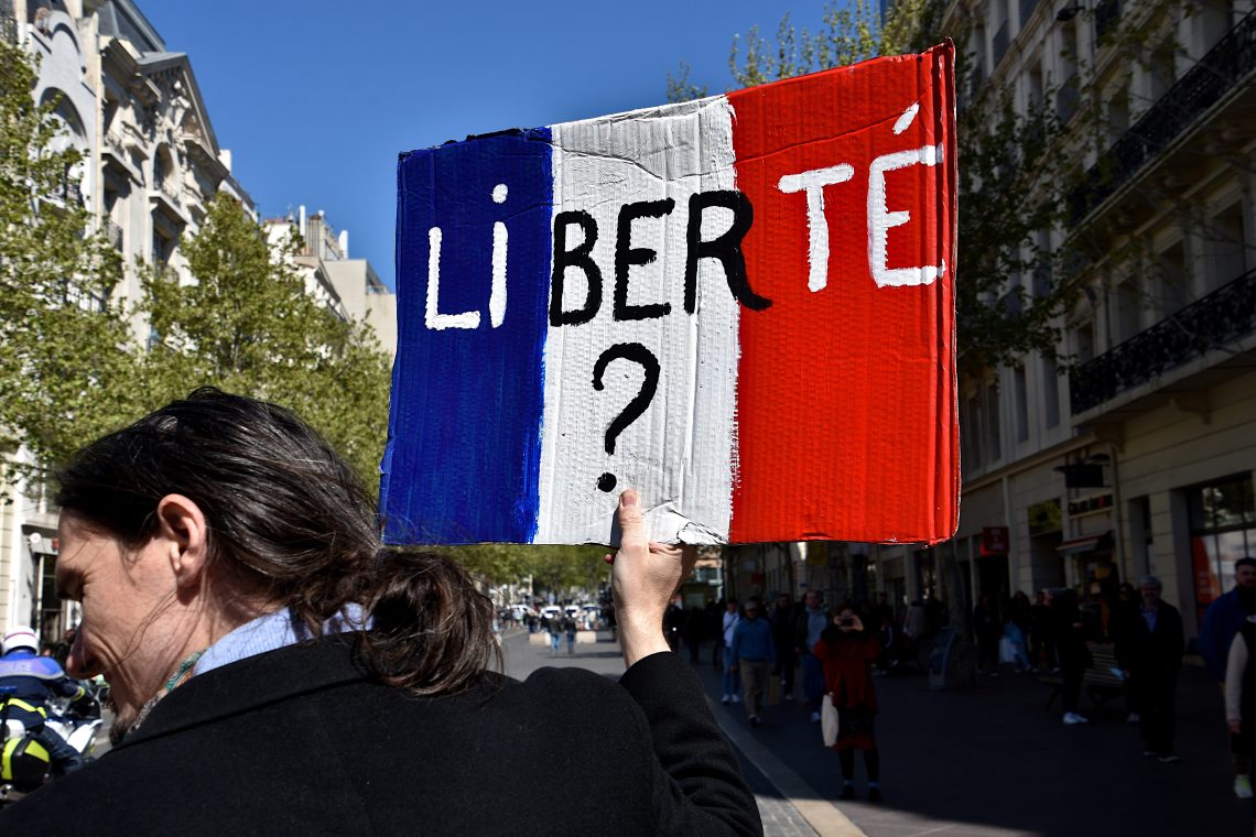 A protester holds a placard during one of many Yellow Vests protests.