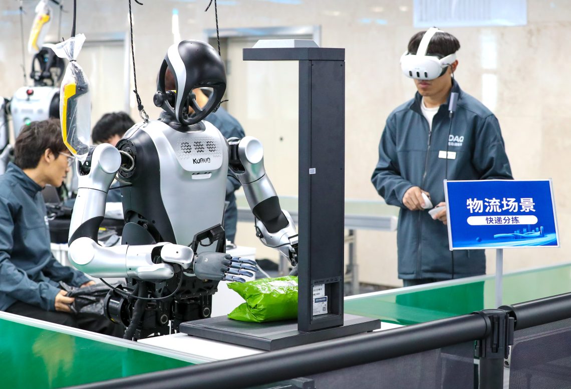 Jan. 12: A robot learns to sort and deliver packages at a data collection training ground for humanoid robots in Qingdao, Shandong, China.